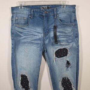AMIRI Faded Blue Ripped Skinny Jeans